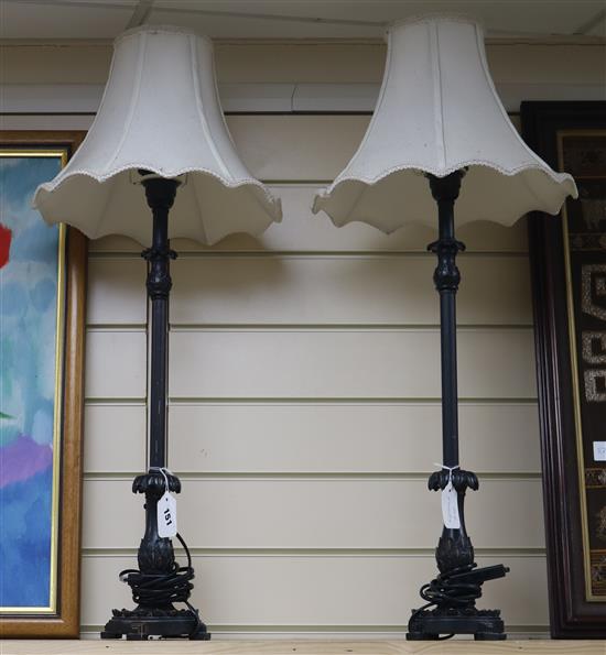 A pair of tall bronzed metal table lamps, with shades height 60cm